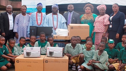 (L-R) Mr. Ambrose Okougbo, Chief Sales Officer, Weco Systems Int'l Ltd; Chief Badejo, Odofin of Noforija Kingdom, HRM Oba Alihu Kolawole Ayodele Alade Uraka of Poka; HRM Oba Babatunde Ogunlaja(JP) Aladeshonyin of Noforija Kingdom; Mr. Nnamdi Onyebuchi, Chief Operating Officer, Weco Systems, Olori Ogunlaja of Noforija; Mrs. Silveria Finnih, Rep. Executive Secretary of Eredo LCDA; Mrs. Evelyn Chukwudubem, Human Resources Manager, Weco Systems and pupils of the recipient schools in Eredo LCDA during the comp